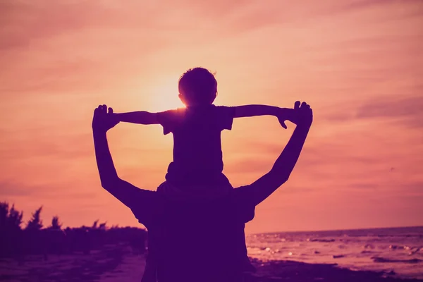 Father and son having fun on sunset sky — Stock Photo, Image