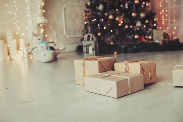 Christmas presents in living room under new year tree