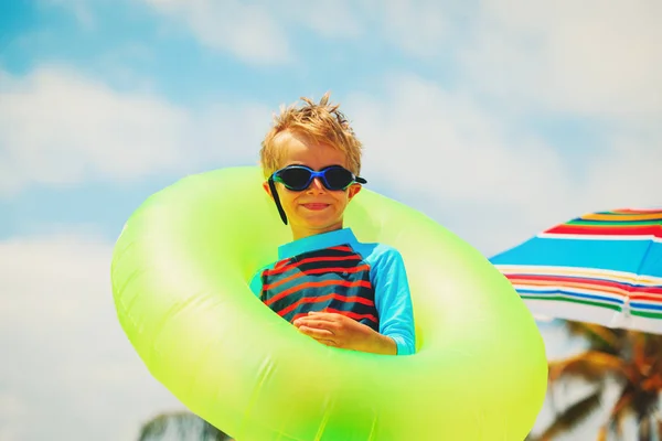 Little boy with life ring at tropical beach — Stock Photo, Image