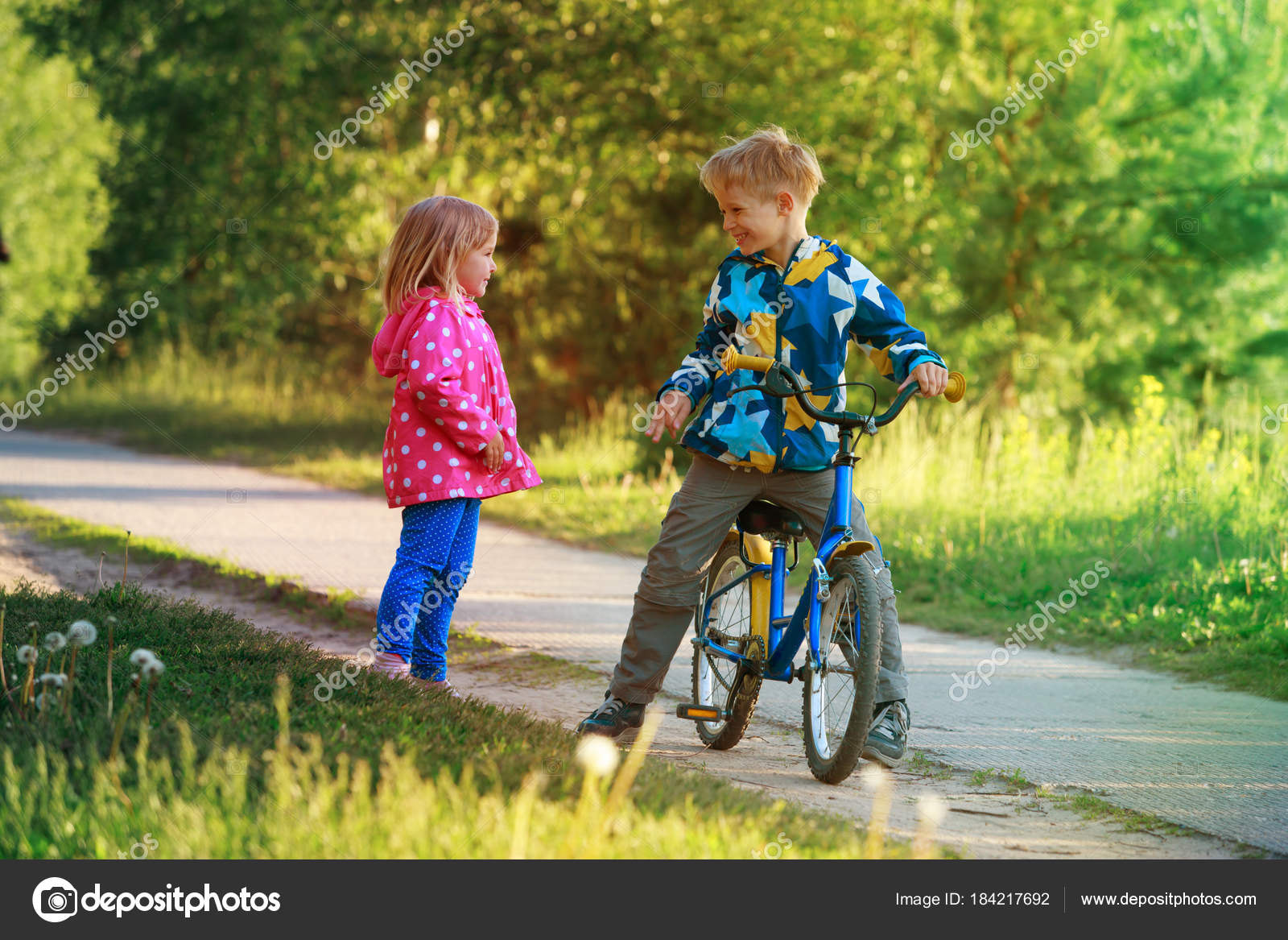 girl riding bike with boy