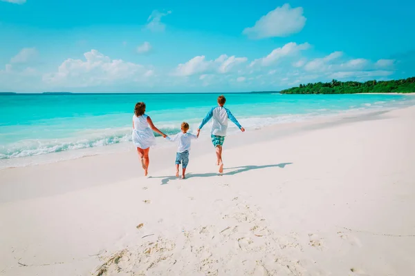 Happy family with kid play run on beach — Stock Photo, Image