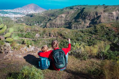 father and son making selfie while travel in mountains