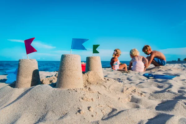 sand castle and kids play with sand on beach