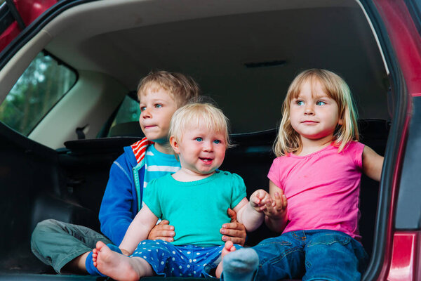 family travel - happy tree kids in car, vacation concept