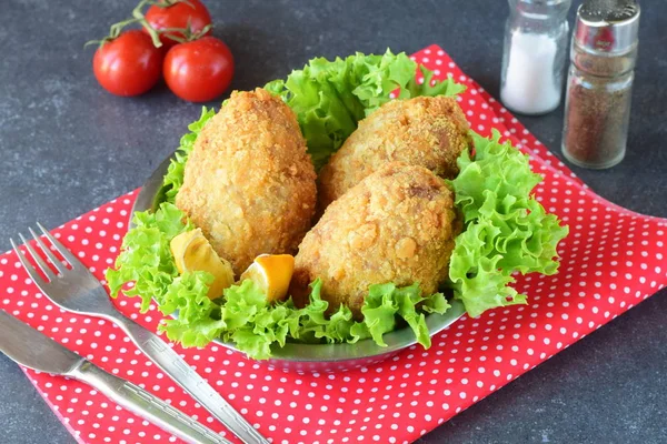 Potato balls with mushrooms inside on a red texture background. Healthy eating concept. — Stock Photo, Image