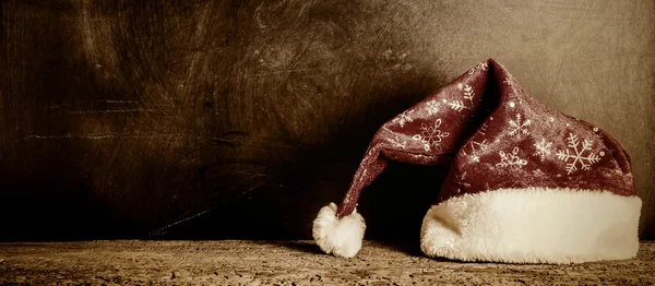 Christmas Santa hat vintage bakgrund — Stockfoto