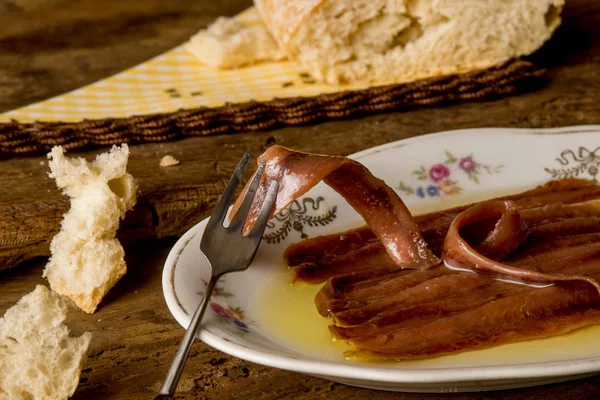 Salted anchovy fillets with olive oil — Stock Photo, Image