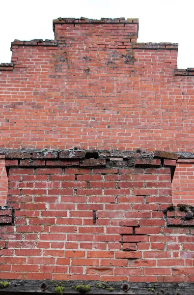 Crumbling Red Brick Wall