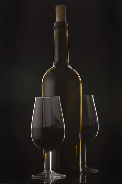 Bottle of wine and vine glass — Stock Photo, Image
