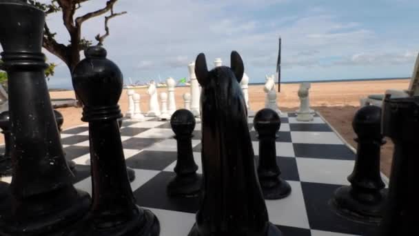 Big chess on the beach on tropical exotic Bali island, Indonesia. Nusa Dua area. Slow motion. — Stock Video