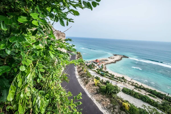 Tropical island landscape, ocean on a bacakground. Beautiful view from the cliff to the coast. Outdoor scenery, Bali island, Indonesia.