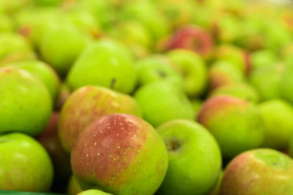 Background of apples on sale at the local organic market of tropical Bali island, Indonesia.