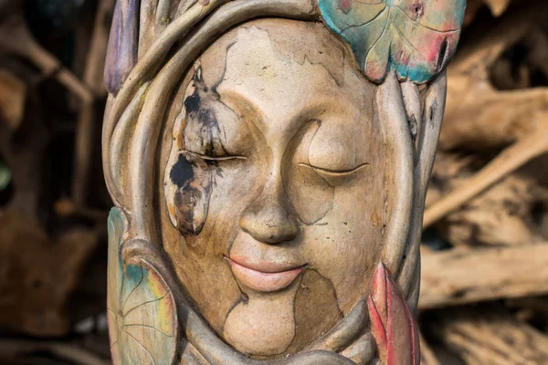 Face wood handmade.Sculpture on the tropical Bali island, Indonesia. Wood carving, art village.