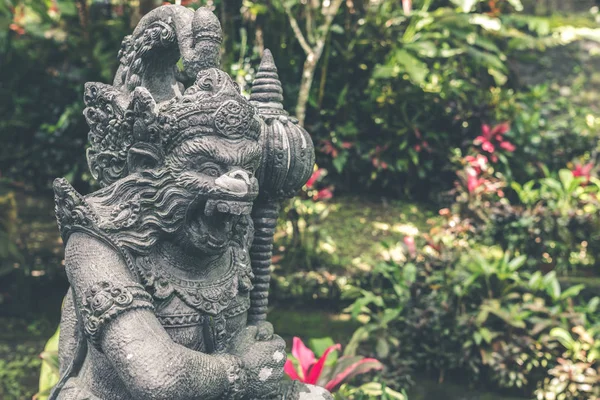 Hindu stone statue in the balinese temple. Tropical island of Bali, Indonesia.