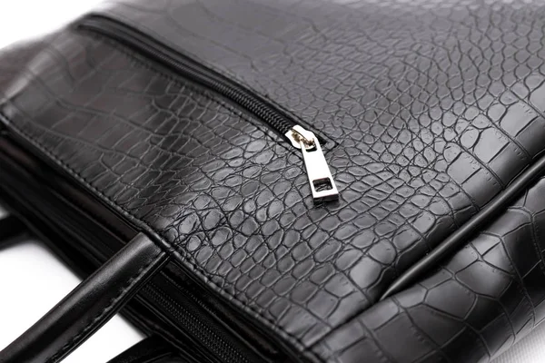 Luxury fashion women leather black handbag isolated on a white background.