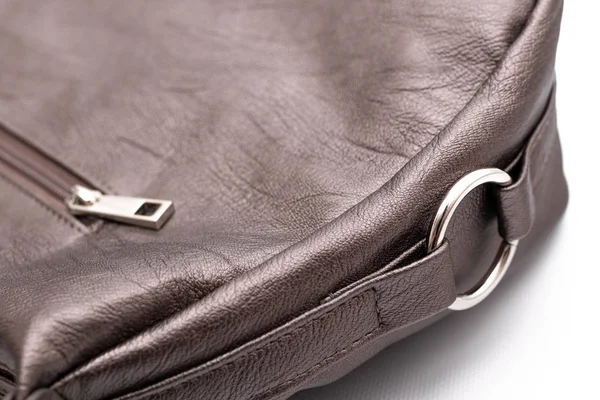 Luxury fashion women leather bronze handbag isolated on a white background.
