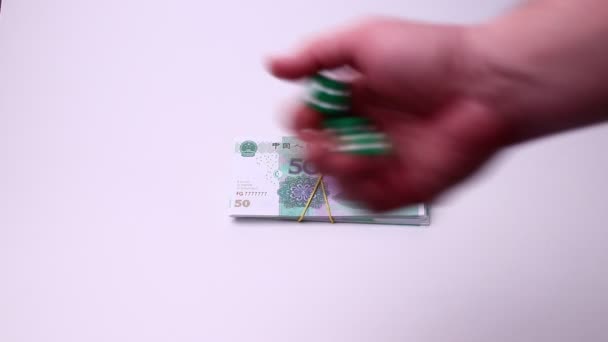 Yuan Chinese currency and dice isolated on a white background. Studio footage, non edited. — Stock Video