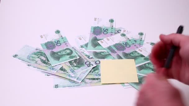 Yuan Chinese currency isolated on a white background. Studio footage, non edited. — Stock Video