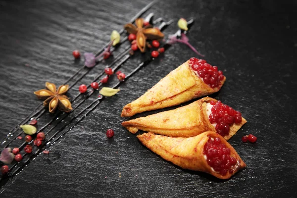 Rabbit pate in crispy horns decorated with spices on a black sto — Stock Photo, Image