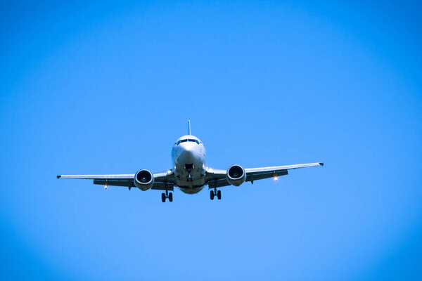 Jet airplane flying overhead close-up