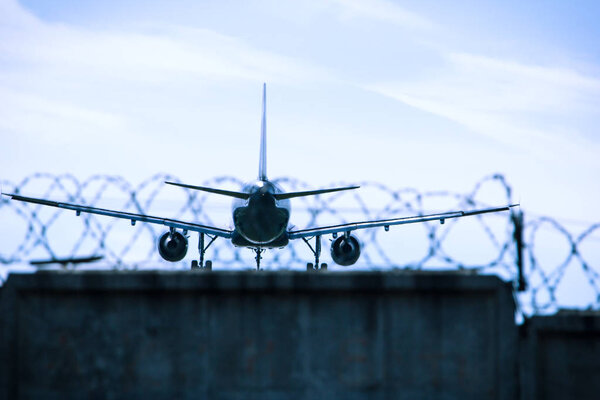 Jet airplane flying overhead close-up