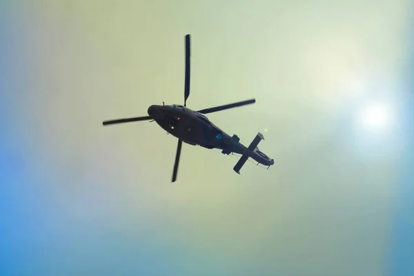 Helicopter flying in the blue sky — Stock Photo, Image