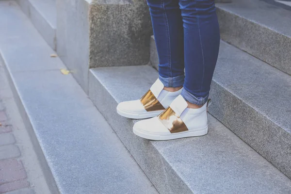 Leather sneakers with gold inserts — Stock Photo, Image