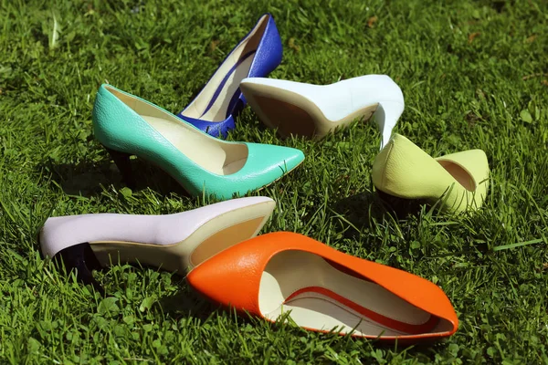 Heels on the grass — Stock Photo, Image