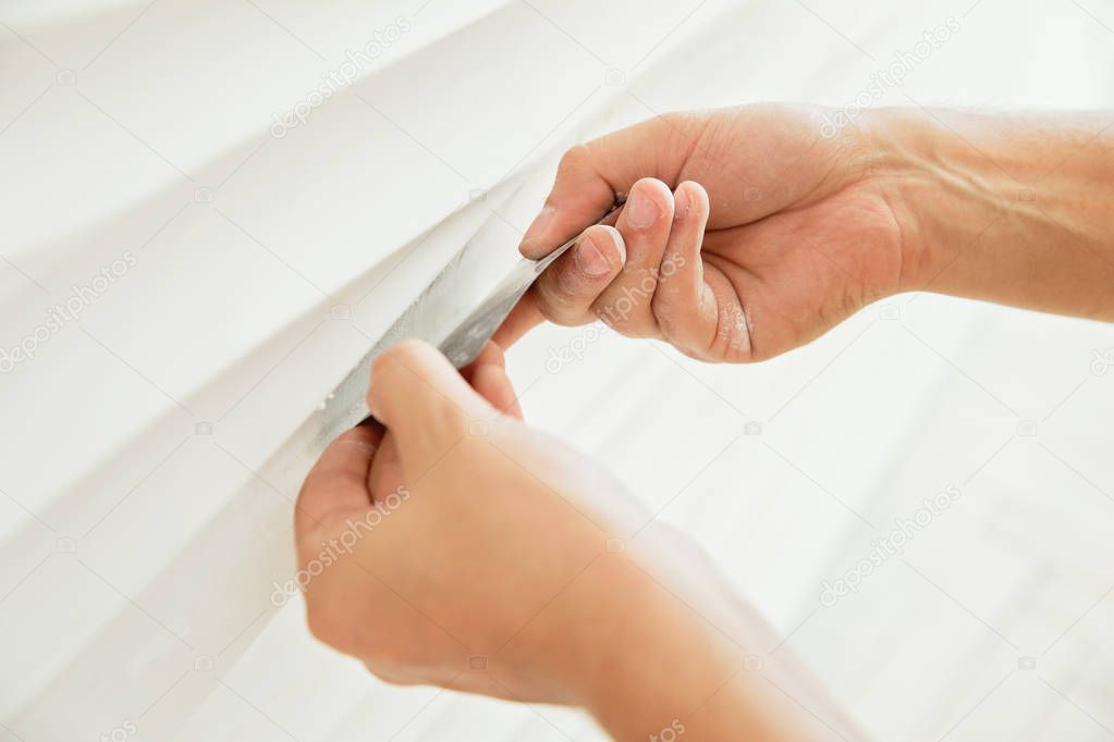 Gypsum panel in the form of a wave on the wall