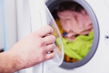 Washing machine in the laundry. Daily routine  clipart
