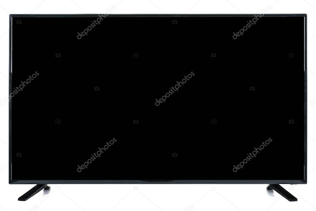 Modern high definition TV. LCD flat monitor with blank black chromakey screen, isolated on abstract blurred white background. Technology and 4k television advertising concept. Detailed studio closeup