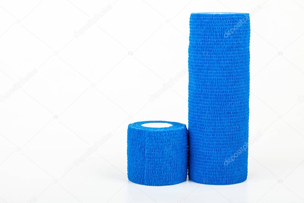 Flexible bandage and laboratory equipment isolated on a white background. Professional clinic instruments. Medical, surgery, ambulance and veterinaryan concept. Closeup with soft selective focus