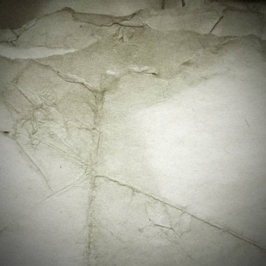 Eski toprak ve kirli lekelerle dolu bir arka plan. Boş eski kağıt çarşaf. Eski ve antika sanat konsepti. Karton, taş, beton ya da doğal mermer gibi desen.