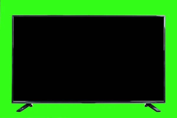 現代の高精細テレビ 抽象的なぼやけた緑のクロマキーの背景に隔離された 空白の黒い画面を持つ液晶フラットモニター 技術と4Kテレビの広告コンセプト 詳細なスタジオクローズアップ — ストック写真