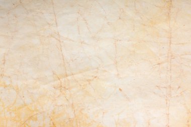 Eski kağıt çarşaf. Toz ve kirli lekelerle dolu boş bir arka plan. Eski ve antika sanat konsepti. Ayrıntılı yakın çekim stüdyo çekimi. Ön manzara. Ayarlanmış