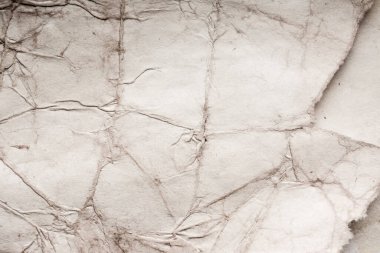 Eski kağıt çarşaf. Toz ve kirli lekelerle dolu boş bir arka plan. Eski ve antika sanat konsepti. Ayrıntılı yakın çekim stüdyo çekimi. Ön manzara. Ayarlanmış