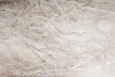 Eski kağıt çarşaf. Toz ve kirli lekelerle dolu boş bir arka plan. Eski ve antika sanat konsepti. Ayrıntılı yakın çekim stüdyo çekimi. Ön manzara. Ayarlanmış