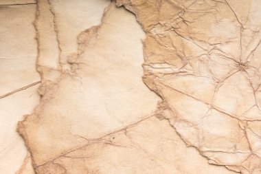 Eski kağıt çarşaf. Toz ve kirli lekelerle dolu boş bir arka plan. Eski ve antika sanat konsepti. Ayrıntılı yakın çekim stüdyo çekimi. Ön manzara. Ayarlanmış