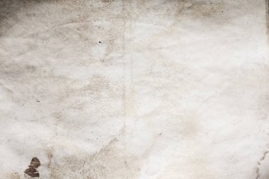 Eski kağıt çarşaf. Toz ve kirli lekelerle dolu boş bir arka plan. Eski ve antika sanat konsepti. Ayrıntılı yakın çekim stüdyo çekimi. Ön manzara. Ayarlanmış