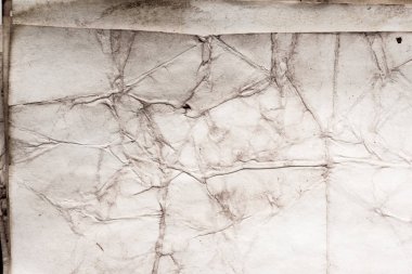 Eski kağıt çarşaf. Toz ve kirli lekelerle dolu boş bir arka plan. Eski ve antika sanat konsepti. Ayrıntılı yakın çekim stüdyo çekimi. Ön manzara. Ayarlanmış