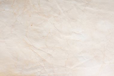 Eski kağıt çarşaf. Toz ve kirli lekelerle dolu boş bir arka plan. Eski ve antika sanat konsepti. Ayrıntılı yakın çekim stüdyo çekimi. Ön manzara. Ayarlanmış