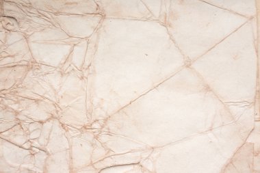 Eski kağıt çarşaf. Toz ve kirli lekelerle dolu boş bir arka plan. Eski ve antika sanat konsepti. Ayrıntılı yakın çekim stüdyo çekimi. Ön manzara. Ayarlanmış