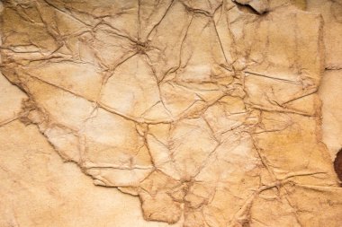 Eski kağıt çarşaf. Toz ve kirli lekelerle dolu boş bir arka plan. Eski ve antika sanat konsepti. Ayrıntılı yakın çekim stüdyo çekimi. Ön manzara. Ayarlanmış