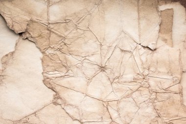 Eski kağıt çarşaf. Toz ve kirli lekelerle dolu boş bir arka plan. Eski ve antika sanat konsepti. Ayrıntılı yakın çekim stüdyo çekimi. Ön manzara. Ayarlanmış