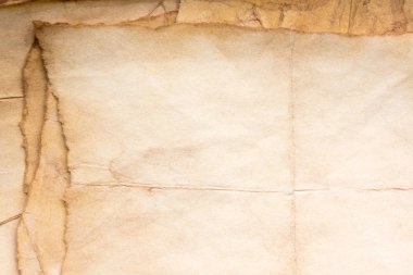 Eski kağıt çarşaf. Toz ve kirli lekelerle dolu boş bir arka plan. Eski ve antika sanat konsepti. Ayrıntılı yakın çekim stüdyo çekimi. Ön manzara. Ayarlanmış