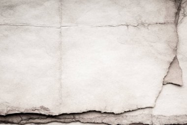 Eski kağıt çarşaf. Toz ve kirli lekelerle dolu boş bir arka plan. Eski ve antika sanat konsepti. Ayrıntılı yakın çekim stüdyo çekimi. Ön manzara. Ayarlanmış