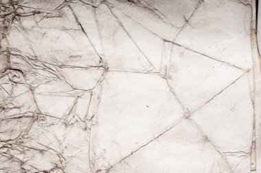 Eski kağıt çarşaf. Toz ve kirli lekelerle dolu boş bir arka plan. Eski ve antika sanat konsepti. Ayrıntılı yakın çekim stüdyo çekimi. Ön manzara. Ayarlanmış