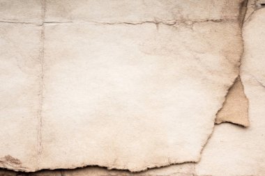 Eski kağıt çarşaf. Toz ve kirli lekelerle dolu boş bir arka plan. Eski ve antika sanat konsepti. Ayrıntılı yakın çekim stüdyo çekimi. Ön manzara. Ayarlanmış