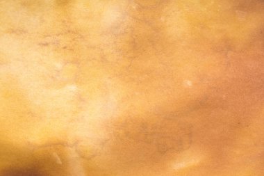 Eski kağıt çarşaf. Toz ve kirli lekelerle dolu boş bir arka plan. Eski ve antika sanat konsepti. Ayrıntılı yakın çekim stüdyo çekimi. Ön manzara. Ayarlanmış