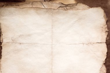 Eski kağıt çarşaf. Toz ve kirli lekelerle dolu boş bir arka plan. Eski ve antika sanat konsepti. Ayrıntılı yakın çekim stüdyo çekimi. Ön manzara. Ayarlanmış